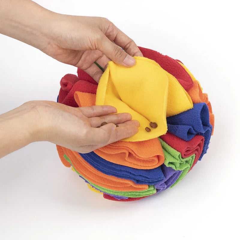 Soft and interactive puzzle ball toy made of polar fleece for dogs and cats to sniff and forage for hidden treats