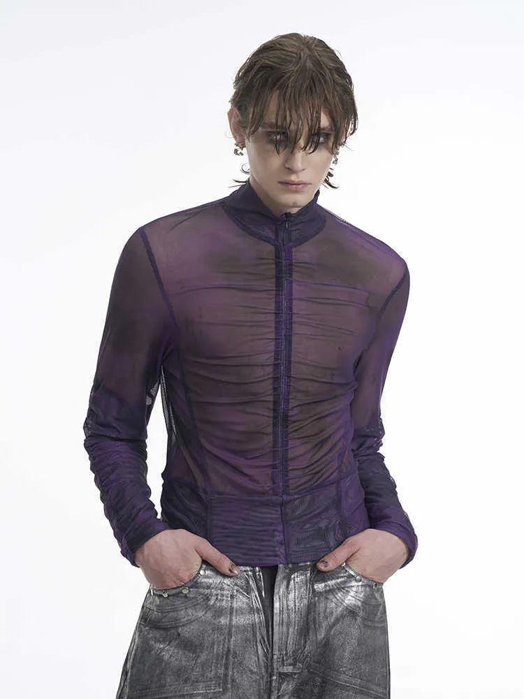 Man wearing a black and red long-sleeved round neck T-shirt showing regular thickness fabric.