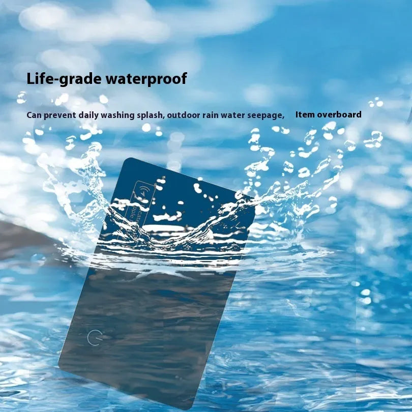 Black ultra-thin anti-loss tracking card next to credit card showing 2.5mm thickness comparison