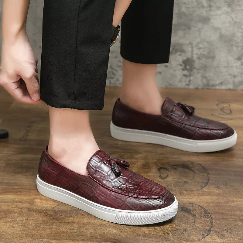 Men's business casual sneakers in black and wine red with leather-like finish and decorative tassels