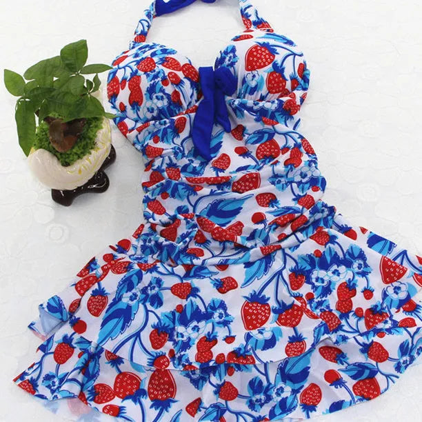 Women's one-piece swimsuit with cross strap backless design and strawberry pattern in blue colour