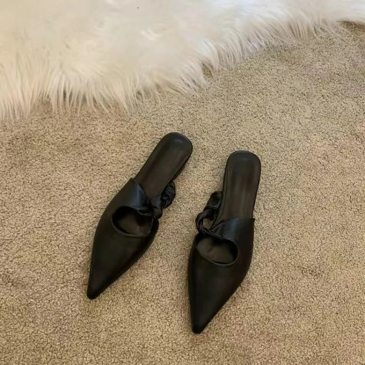 Women's soft leather slippers with semi-toe box in black, khaki, cream-white, and dark brown colours on a rubber sole.
