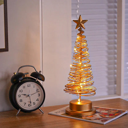 Lighted metal Christmas tree with warm white LED lights, creating a cozy holiday decor for homes and offices.