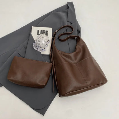 Women's soft PVC bucket shoulder bag with single strap, open pocket, phone pocket, and matching wallet