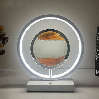 Creative minimalist quicksand table lamp with adjustable three-colour LED lighting on wooden surface