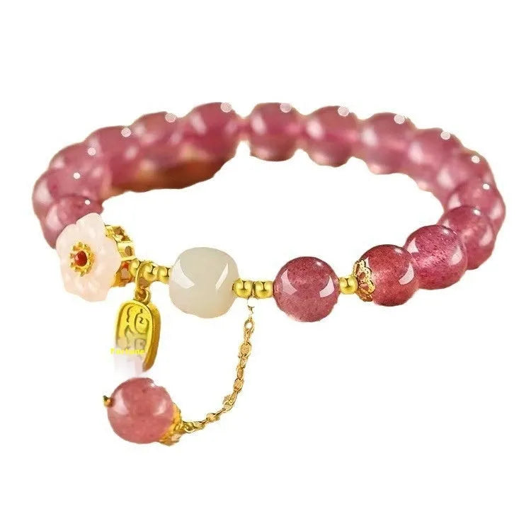 Handcrafted strawberry quartz crystal bracelet with adjustable string closure and Hetian jade peach blossom design