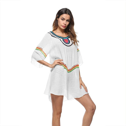 Women's crocheted ethnic style beach cover-up top in apricot colour, for sun protection.