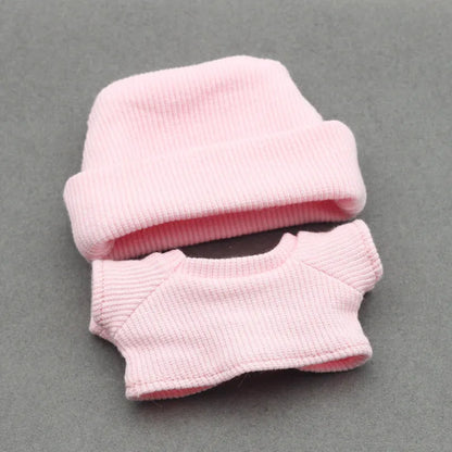 Doll clothes set with knitted flanging hat and T-shirt in multiple colours including pink, white, and stripes.