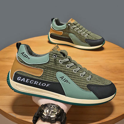 Men's grey and green mesh running shoes with lace-up front and low-top ankle design