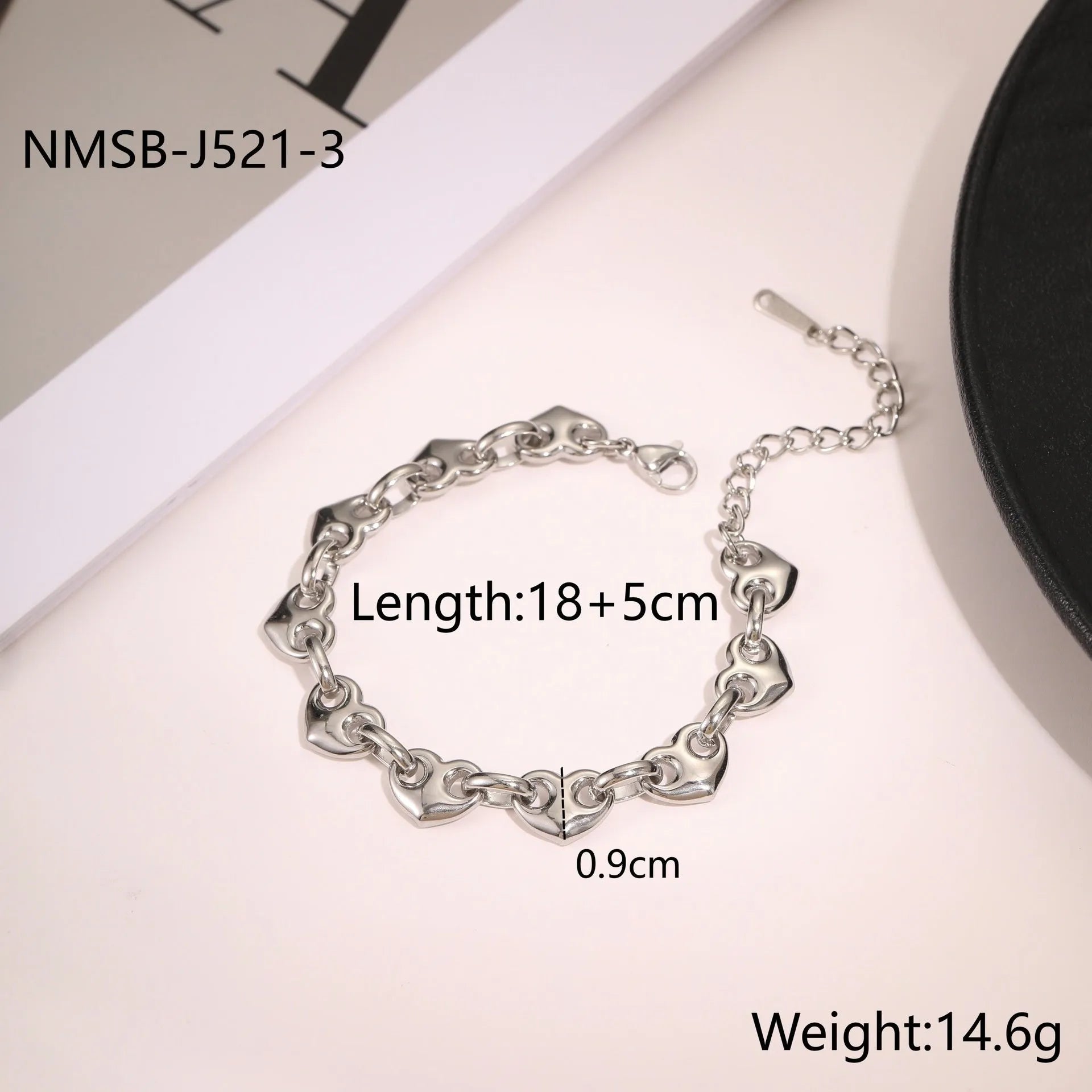 Women's hollow heart bracelet in stainless steel with 18K gold plating, shown in colour block, gold, and steel finishes