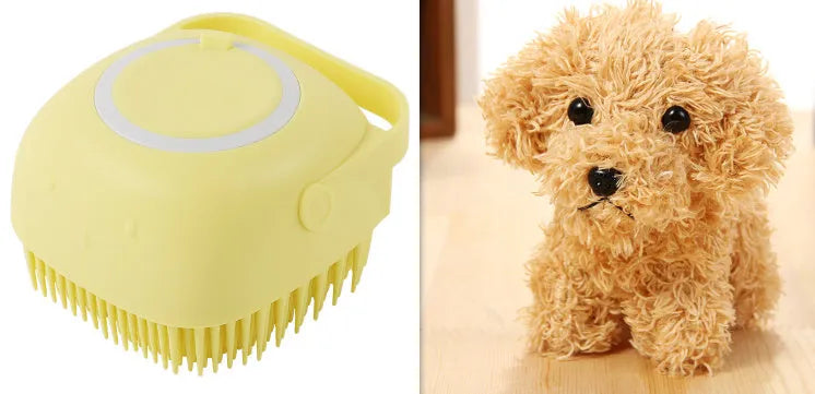 Blue silicone dog bath and massage brush held in a hand.