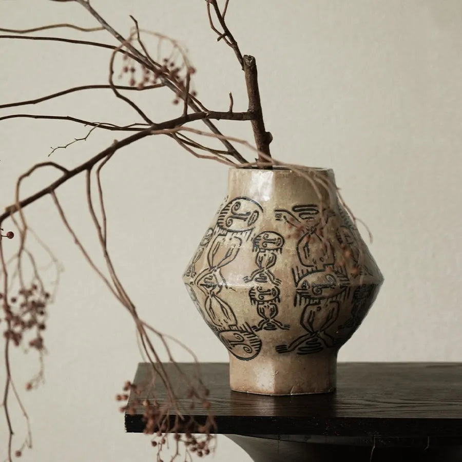 Hand-painted ceramic vase with religious patterns and carved texture in cylindrical shape