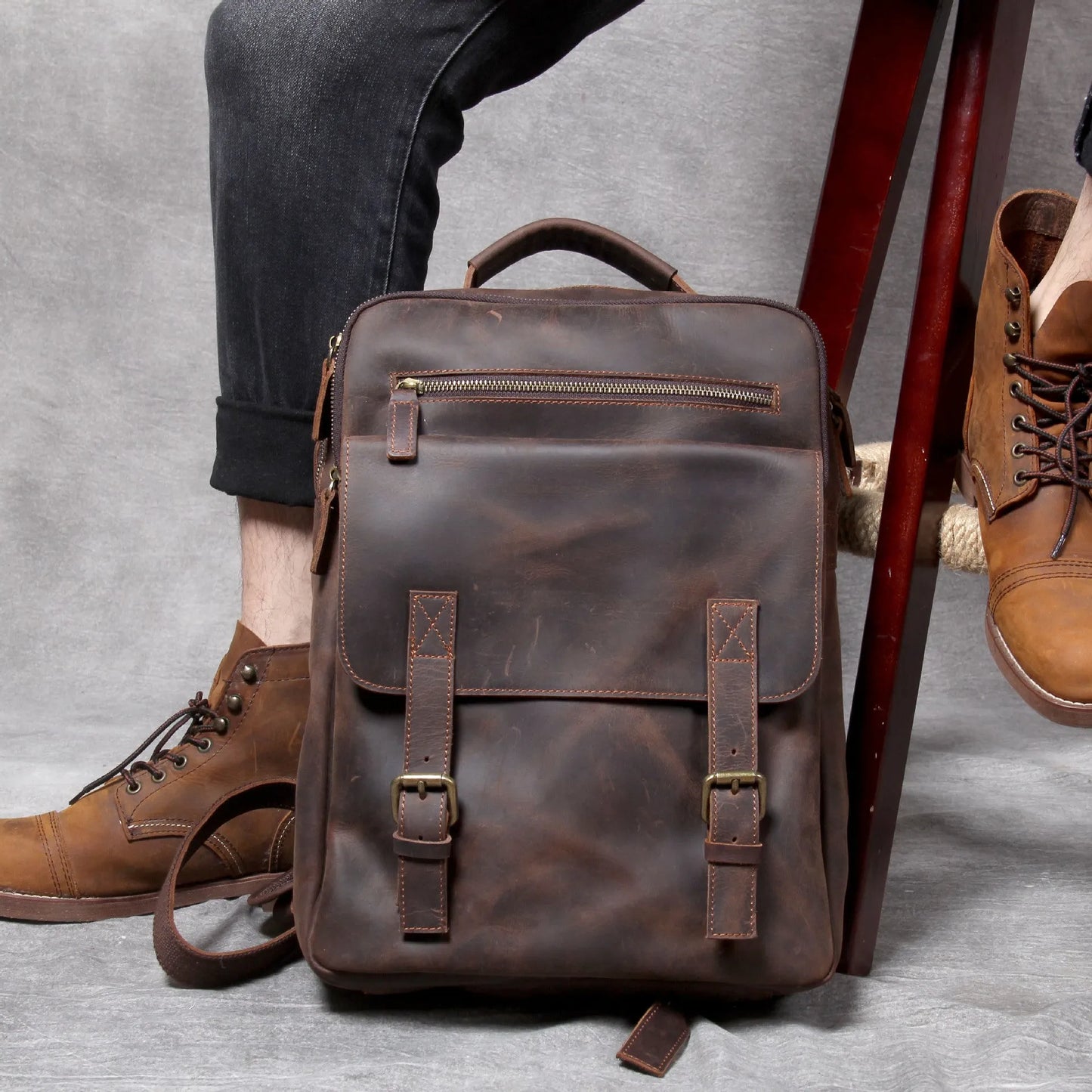 Dark coffee coloured retro leather backpack made from first layer cowhide with organised interior pockets.