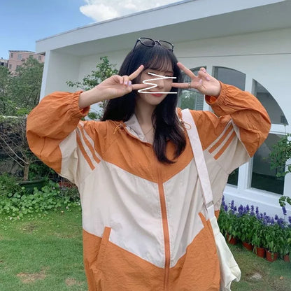 Women's lightweight hooded sun protection coat in blue, red, or orange