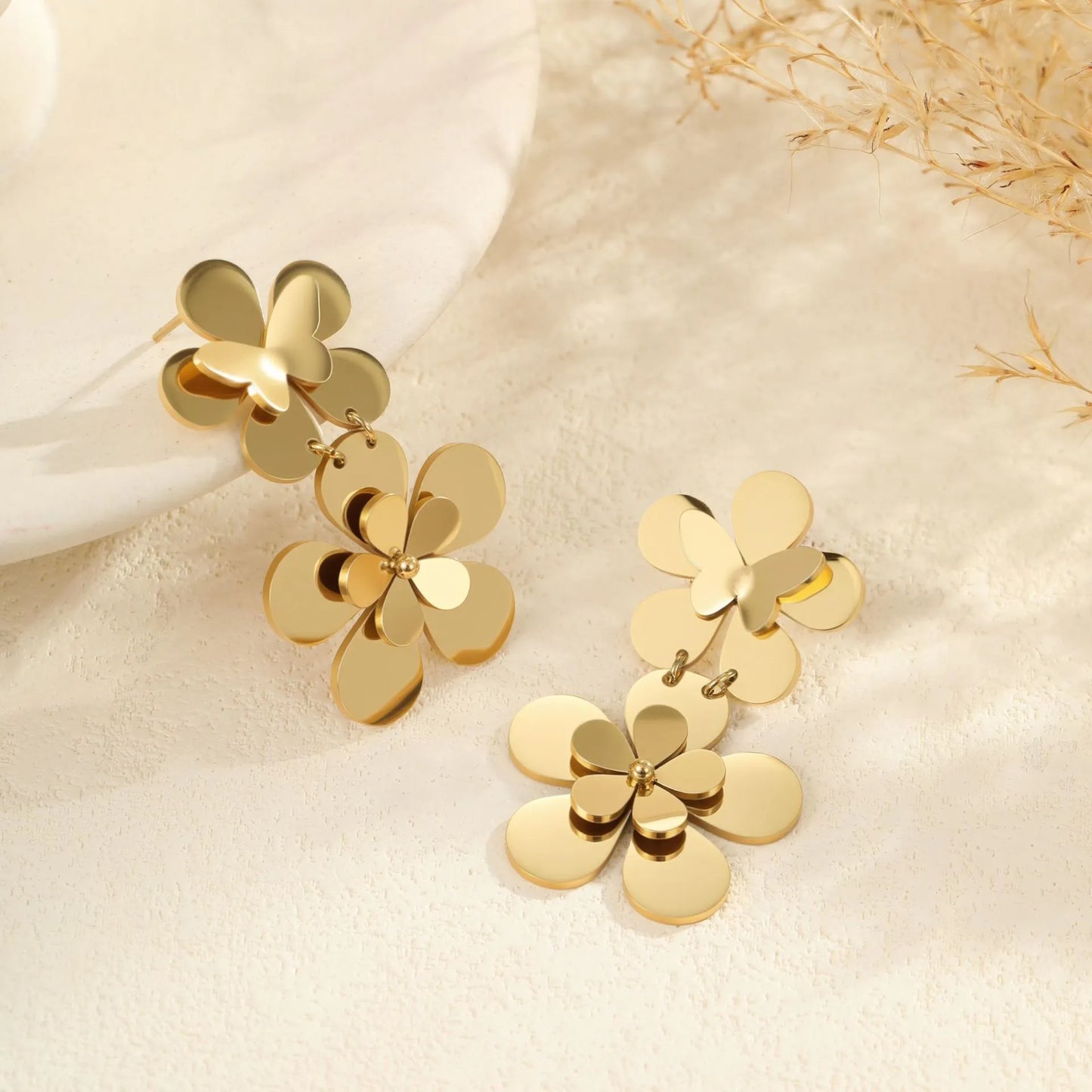 Gold electroplated stainless steel flower butterfly earrings for women with geometric and animal zodiac designs