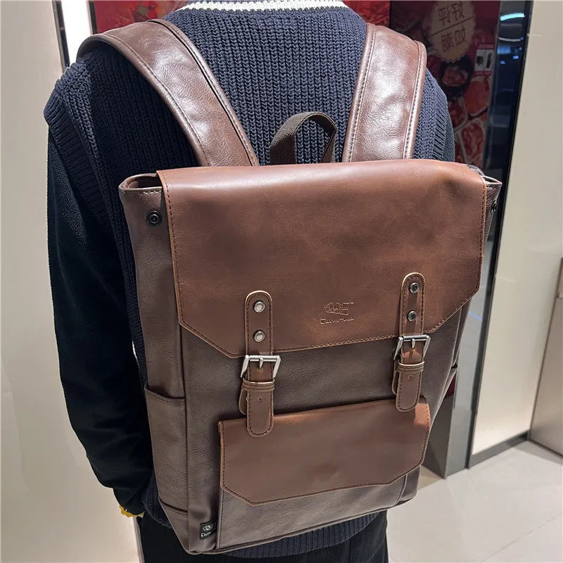 Unisex large capacity PU backpack in a solid colour, shown in college style.