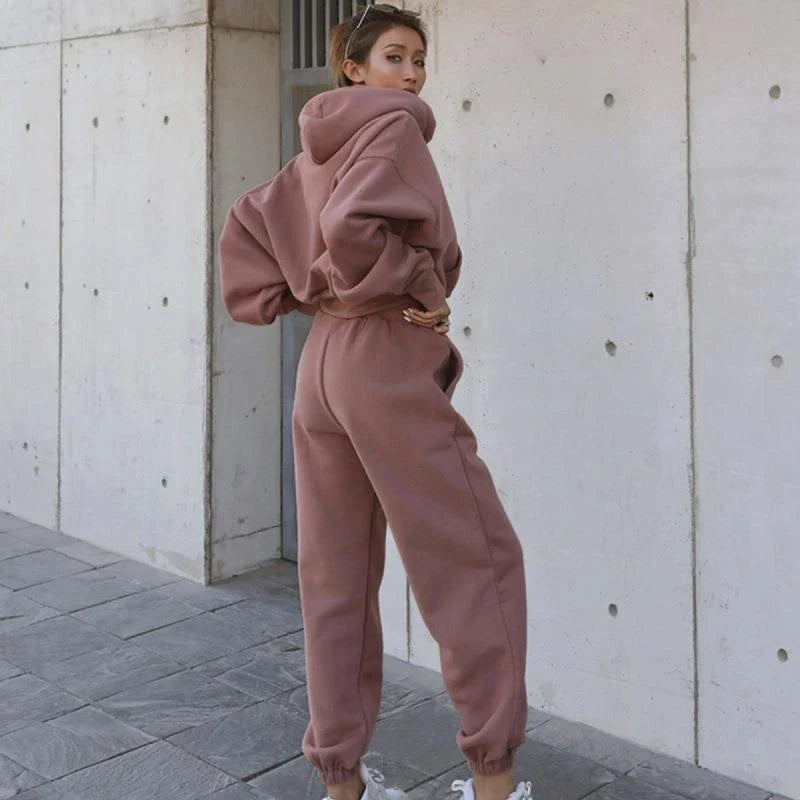 Women's casual hoodie outfit in various colors and sizes, featuring a stylish design and comfortable polyester construction.