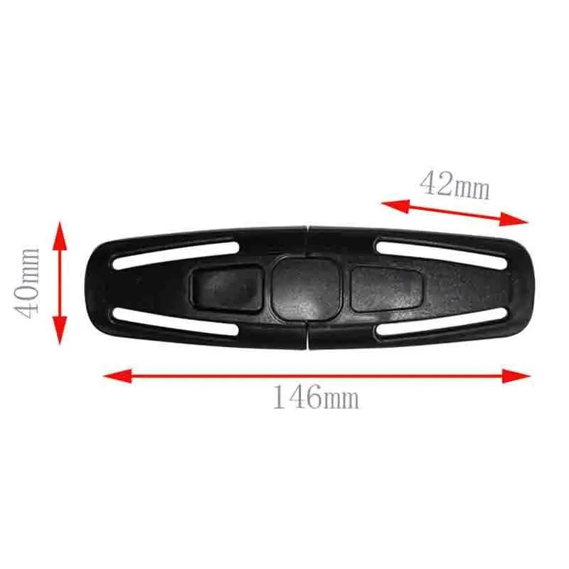 Black nylon child safety seat chest clip with lock button for 5-point harness, shown next to a ruler for scale.