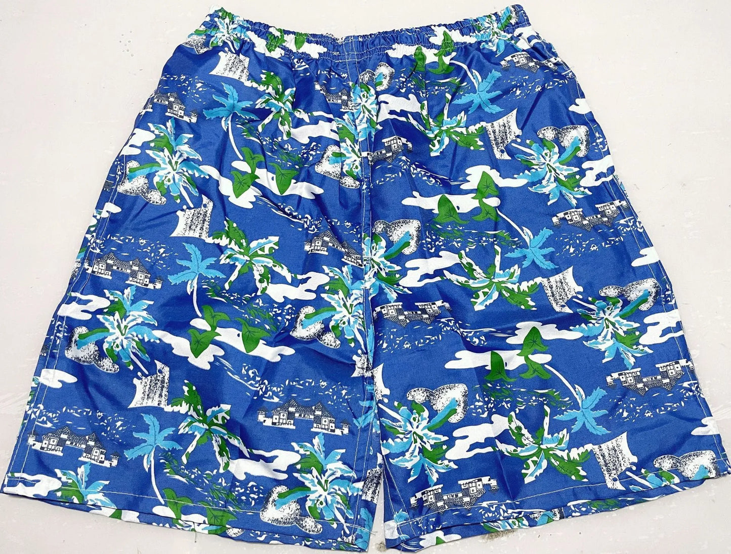 Men's floral printed swimming trunks in polyester fabric showing multiple pattern options for beach and pool use