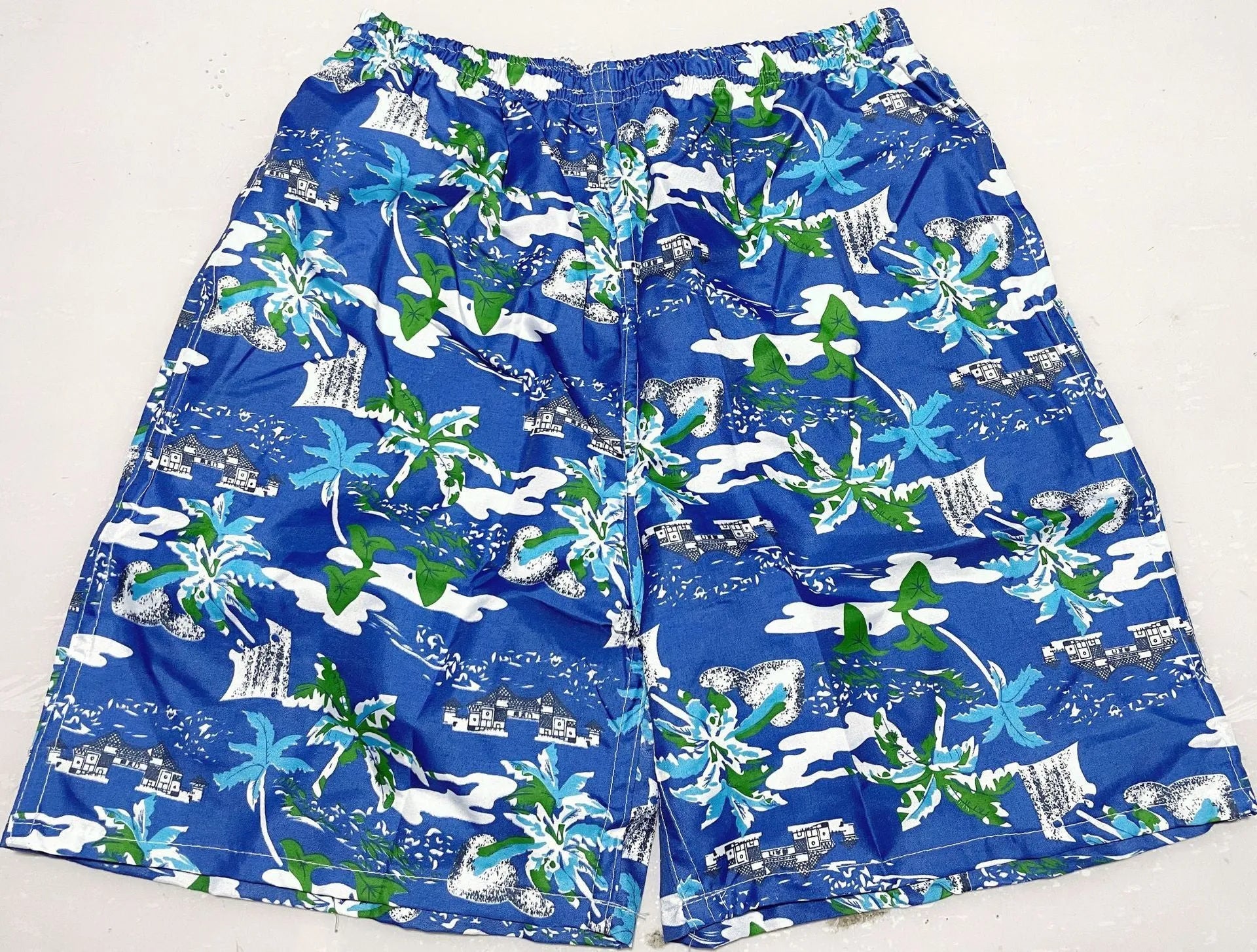 Men's floral printed swimming trunks in polyester fabric showing multiple pattern options for beach and pool use