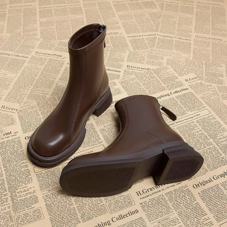 Women's black thick heel ankle boots with back zipper and round toe on flat rubber sole