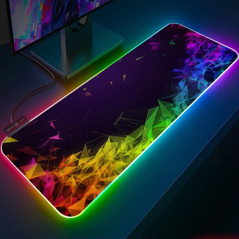 Black RGB gaming mouse pad with illuminated surface measuring 900x400mm and 4mm thickness