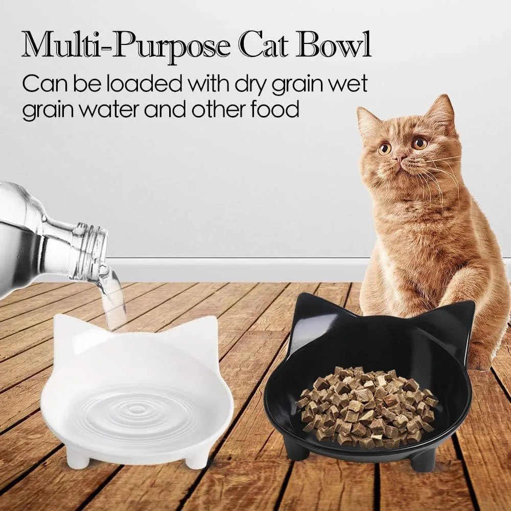 Black shallow melamine pet bowl with non-slip rubber base on a kitchen floor