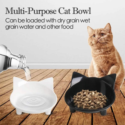 White shallow melamine cat bowl with non-slip black rubber base on a wooden floor.