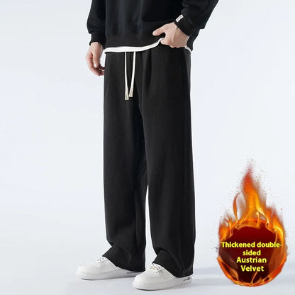Men's double-sided polar fleece-lined trousers in apricot, black, or dark grey with elastic waist and loose fit for winter.