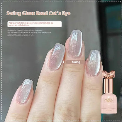 Bottle of micro glass bead cat's eye gel nail polish for magnetic nail art.