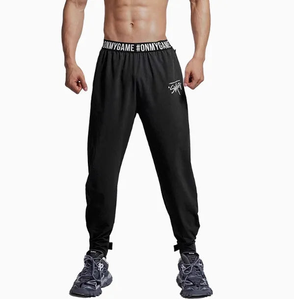 Women's loose sports cropped pants in grey with printed waistband for workouts and running activities