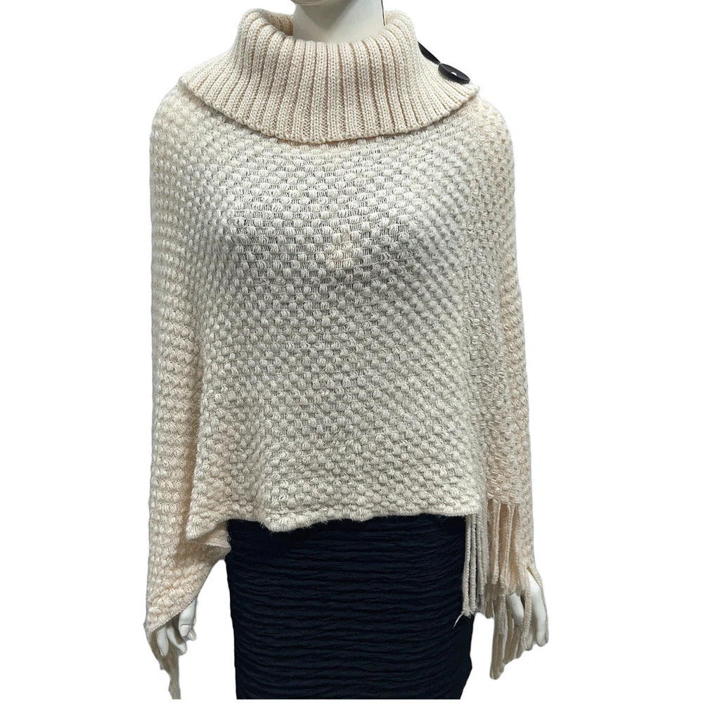 Sleeveless polka dot shawl in apricot colour draped over chair, showing 150cm length and acrylic fibre texture