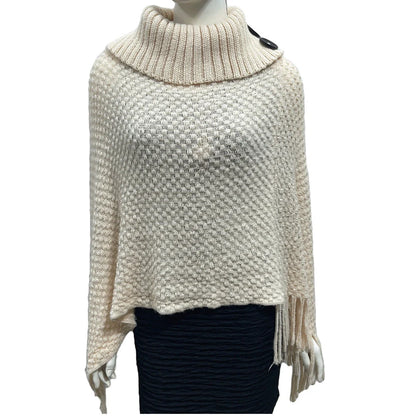 Sleeveless polka dot shawl in apricot colour draped over chair, showing 150cm length and acrylic fibre texture