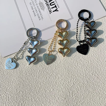 Acrylic key ring with an electroplated decorative charm in a choice of heart, bell, or water drop shapes.