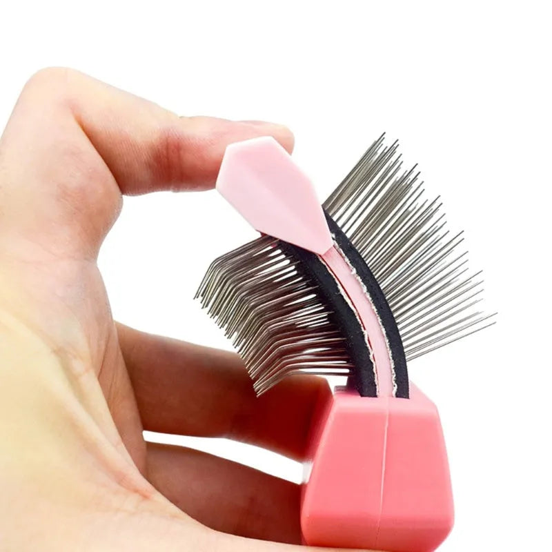 A blue double-sided pet grooming brush with stainless steel pins and a non-slip handle.
