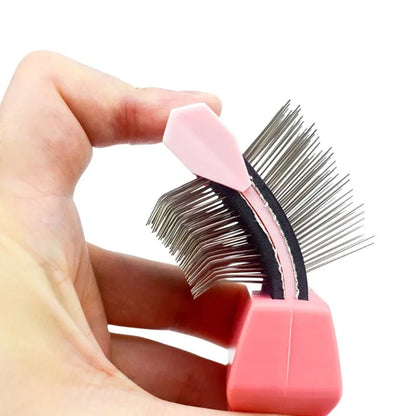 A blue double-sided pet grooming brush with stainless steel pins and a non-slip handle.