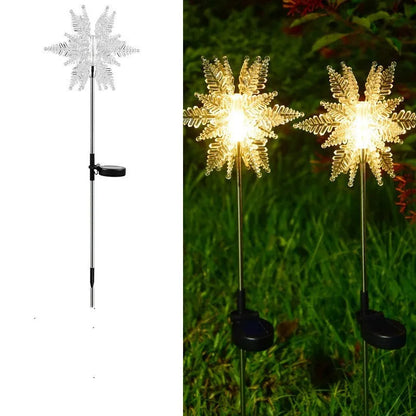 LED solar snowflake garden light with flower-shaped head, warm light, and 2V 100mA solar panel for outdoor lawn use