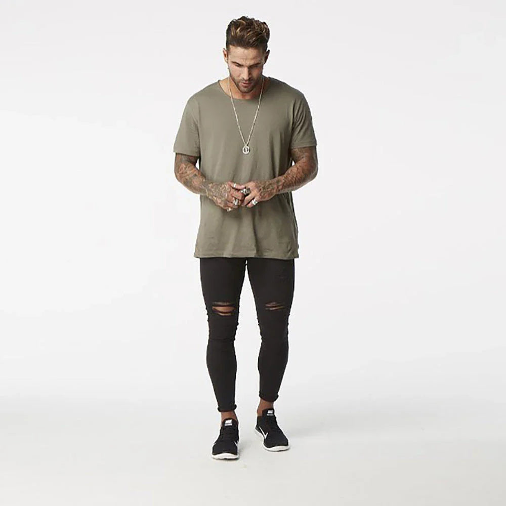 Premium Distressed Men's Skinny Jeans in Black, featuring a skinny silhouette and trendy distressed details for a casual cool style.