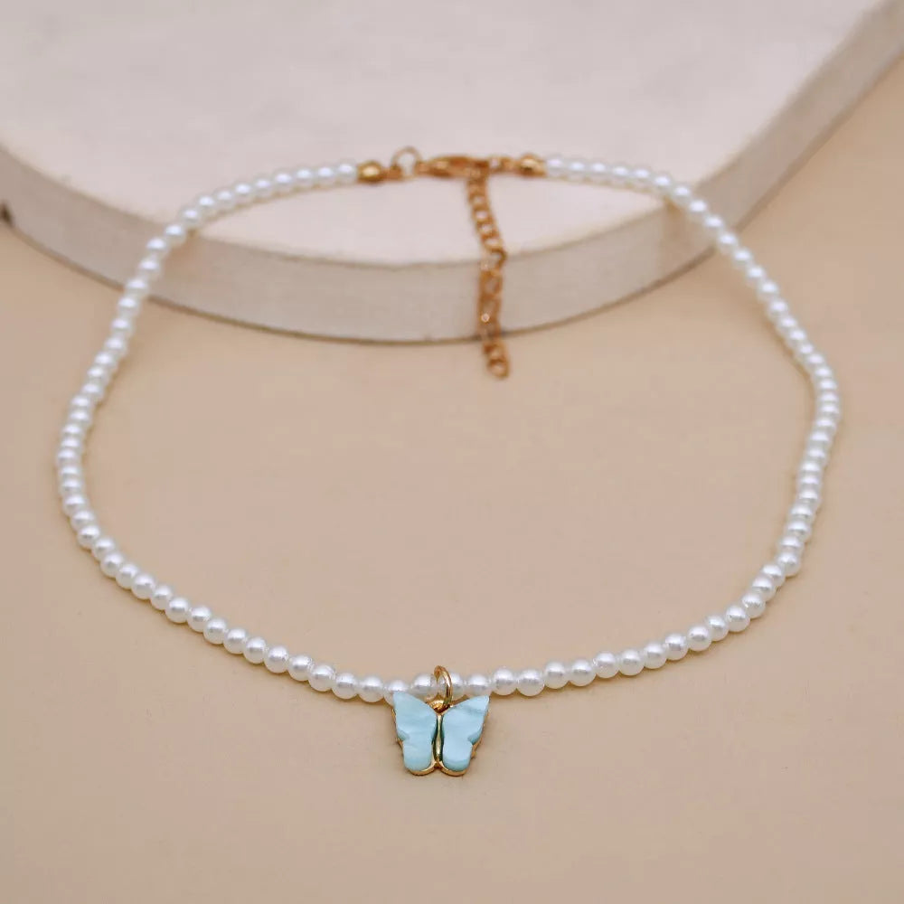 Elegant white pearl choker necklace with butterfly charm for women