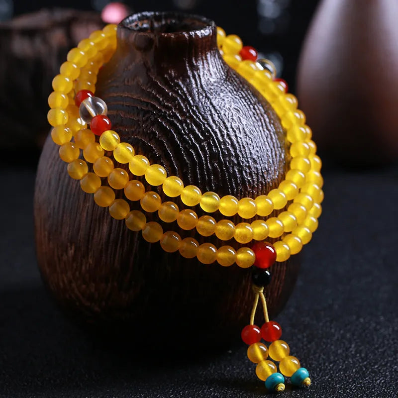 Women's crystal necklace with 108 geometric beads and lucky cat charms