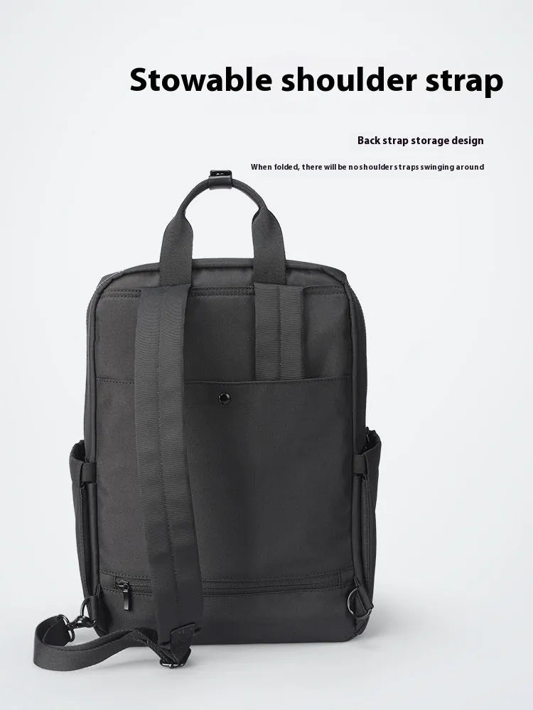 Elegant black Oxford cloth computer backpack with a 20-35 litre capacity.