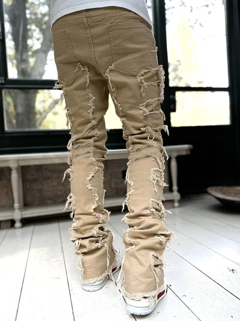 Stylish patched men's jeans with tight, stacked fit and variety of vibrant color options