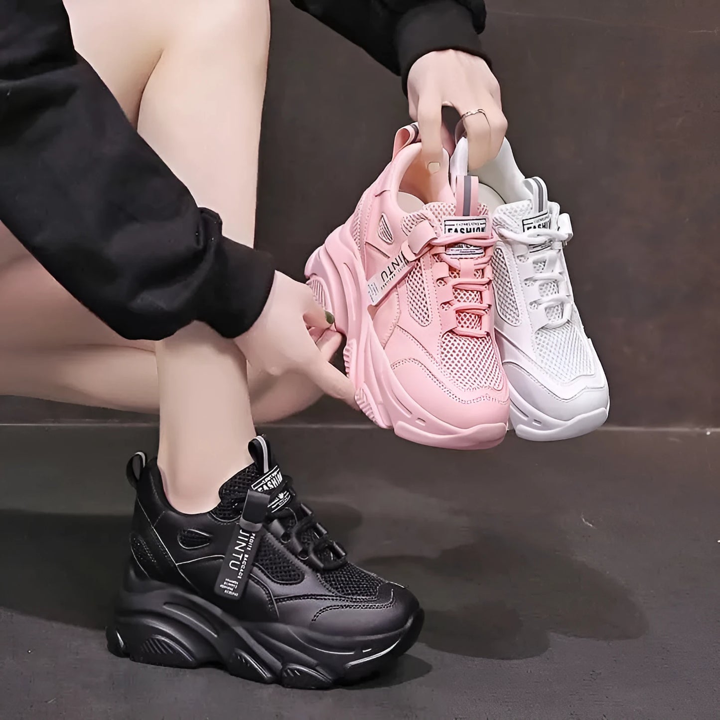 Women's black mesh platform casual shoes with hollow-out design detail on white background