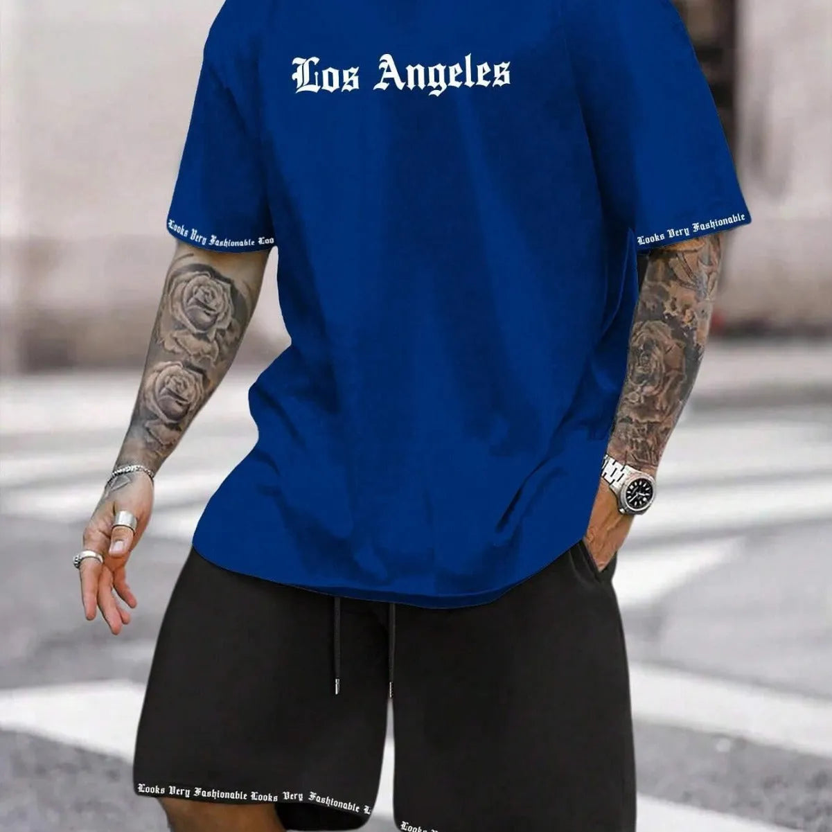 Printed short-sleeve top and matching shorts from a quick-drying sports suit set on a hanger