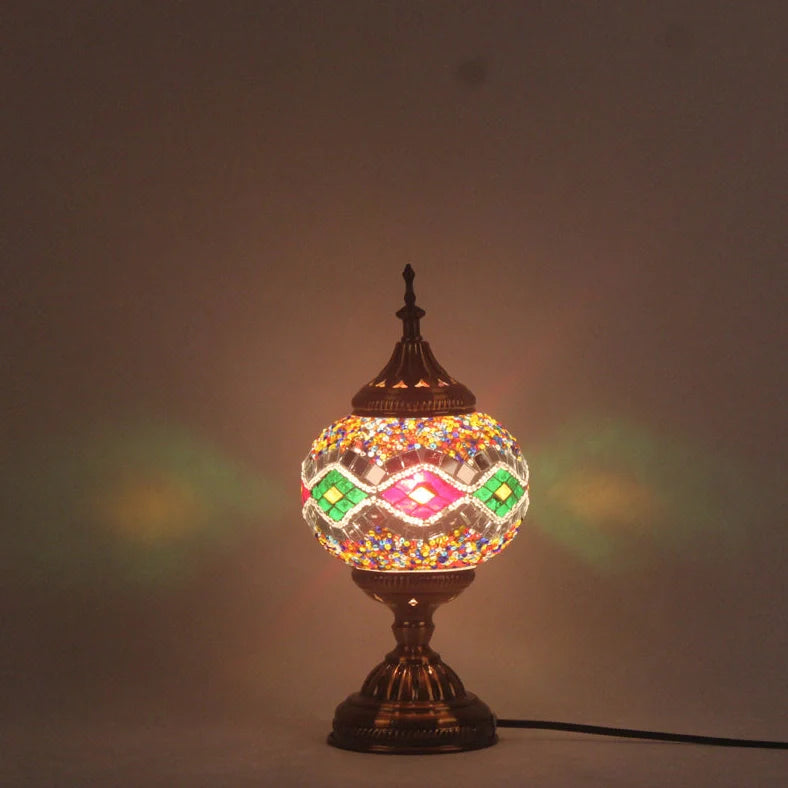 Glass table lamp with 150mm diameter shade and 330cm cord on wooden surface