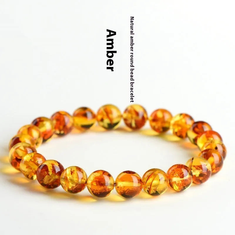 Natural yellow piebald amber bracelet with 7-10mm geometric beads on wrist