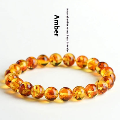 Natural yellow piebald amber bracelet with 7-10mm geometric beads on wrist