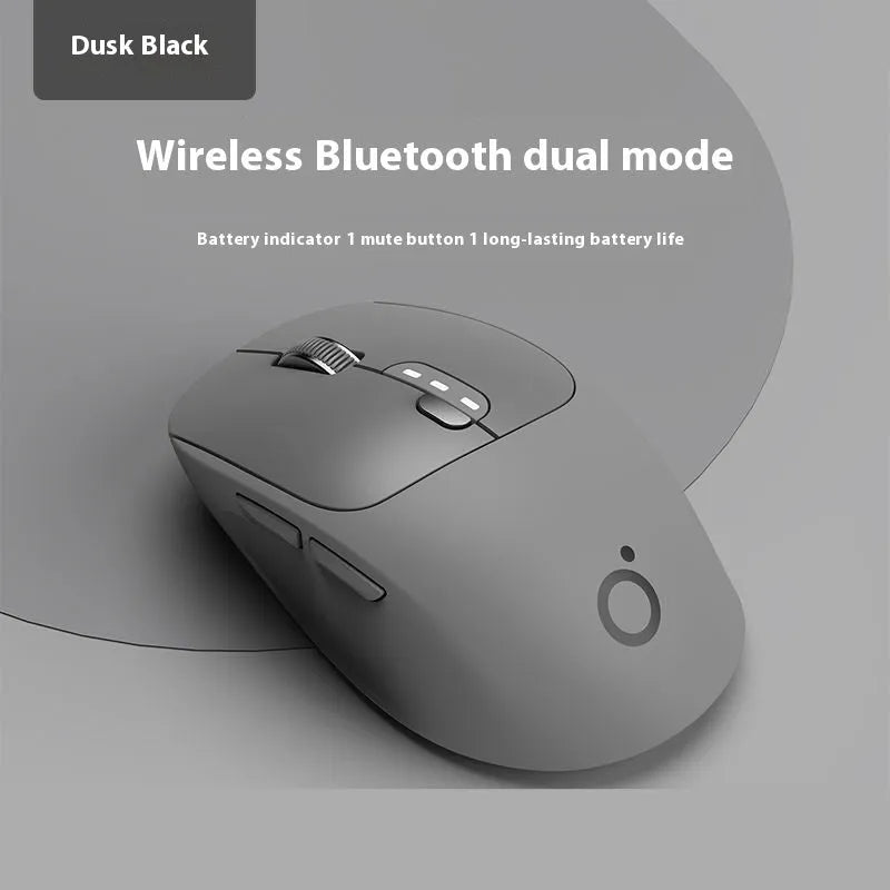 Mute wireless Bluetooth computer mouse in Matcha Green colour on a desk, showing its compact size and 5-button layout.