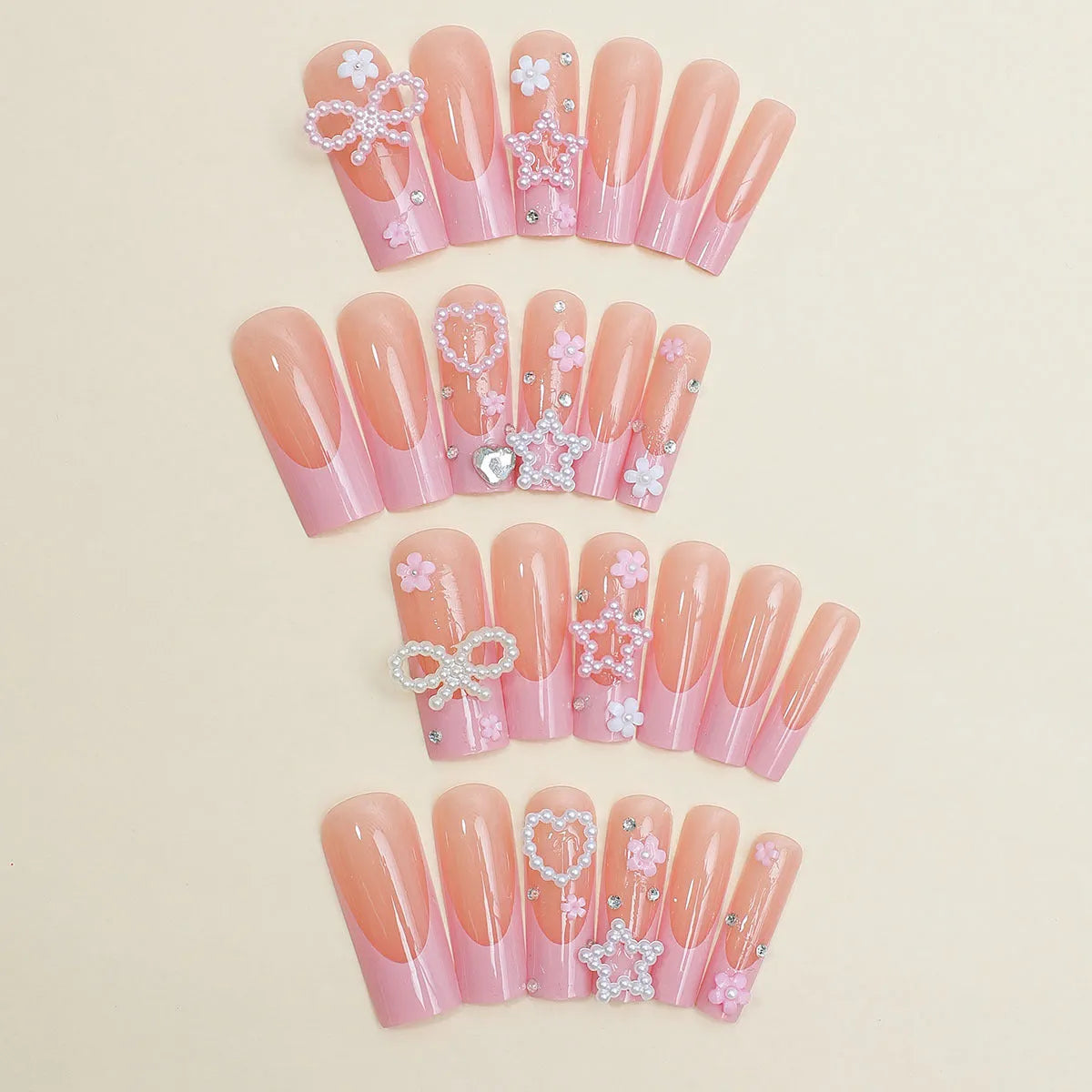 Nail art set showing super long water pipe French spot drill designs with a bow and love pattern in colour XB-70-48.