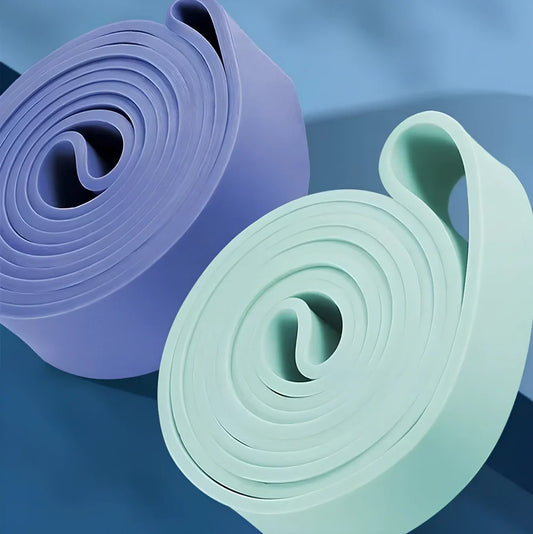 Five coloured resistance bands showing progressive thickness from 6.4mm to 45mm for home fitness training